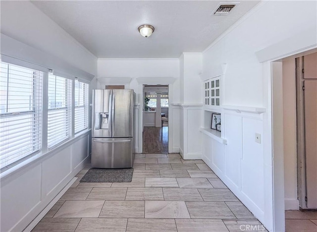 4216 Dalton Ave, Los Angeles, CA 90062 - kitchen with stainless steel refrigerator with ice dispenser and a decorative wall