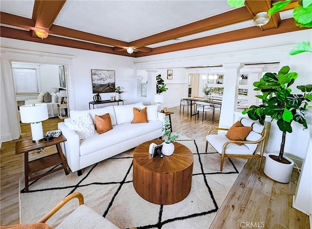 4216 Dalton Ave, Los Angeles, CA 90062 - living room featuring wood finished floors and beamed ceiling