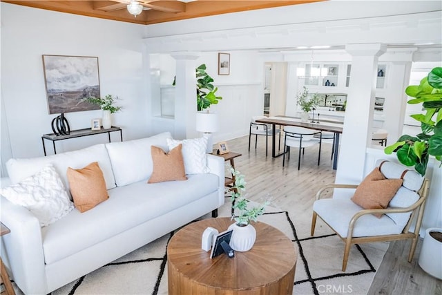 4216 Dalton Ave, Los Angeles, CA 90062 - living area featuring wood finished floors, ceiling fan, and decorative columns