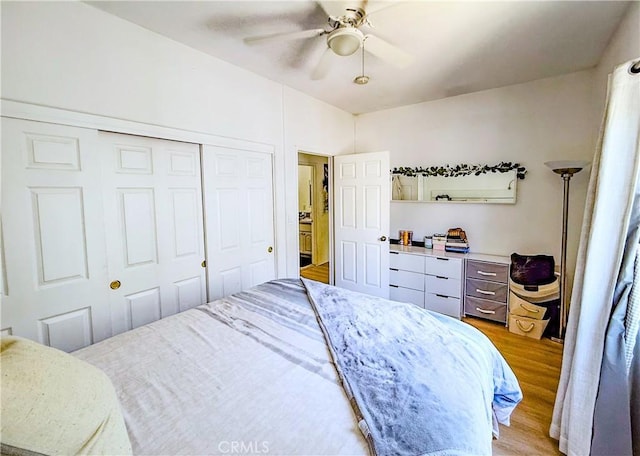 4216 Dalton Ave, Los Angeles, CA 90062 - bedroom with light wood finished floors, a closet, and a ceiling fan