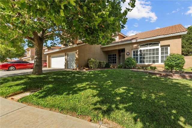 42012 57th St W, Lancaster, CA 93536 - ranch-style home featuring stucco siding, a front yard, an attached garage, a tiled roof, and concrete driveway