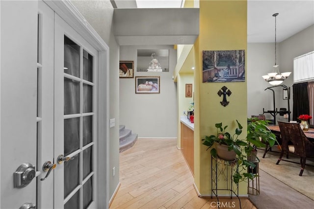 42012 57th St W, Lancaster, CA 93536 - hall featuring wood finished floors and a chandelier