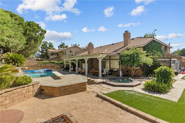 42012 57th St W, Lancaster, CA 93536 - view of swimming pool featuring an in-ground hot tub, a patio area, and a fenced backyard