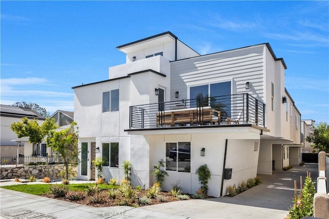 2405 Mathews Ave Unit C, Redondo Beach, CA 90278 - view of front of home with a balcony and stucco siding