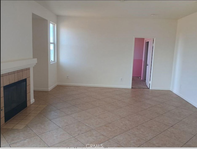 13182 Kootenay, Victorville, CA 92395 - unfurnished living room with a tile fireplace and light tile patterned flooring
