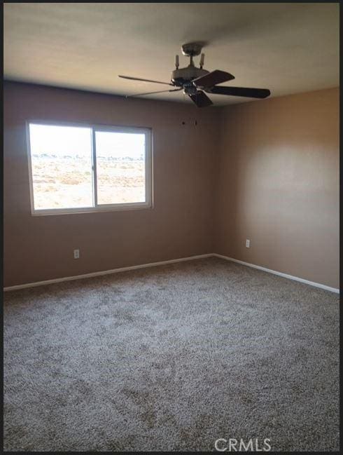 13182 Kootenay, Victorville, CA 92395 - carpeted spare room with baseboards and ceiling fan