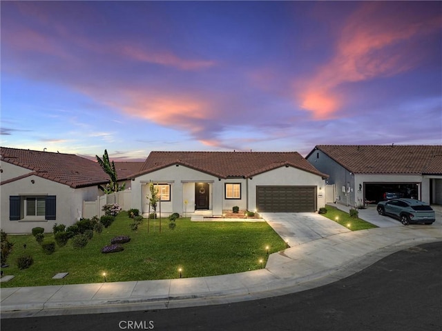 7305 Scrivia Ct, Bakersfield, CA 93311 - view of front of property featuring an attached garage, stucco siding, driveway, and a tile roof