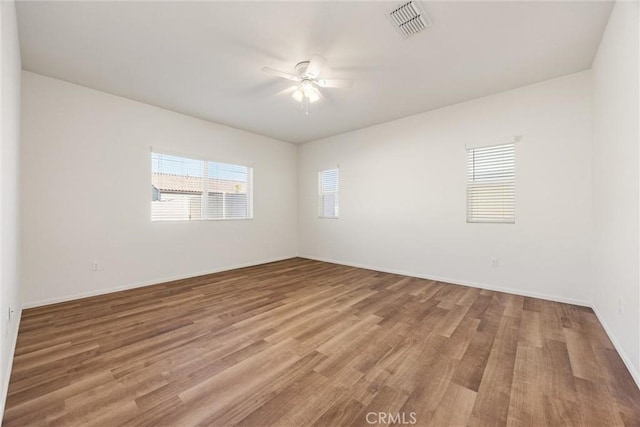 7305 Scrivia Ct, Bakersfield, CA 93311 - unfurnished room with a ceiling fan and wood finished floors