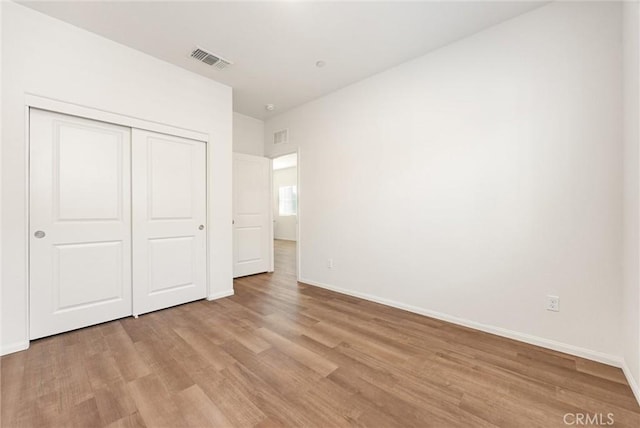 7305 Scrivia Ct, Bakersfield, CA 93311 - unfurnished bedroom with light wood-style flooring and a closet