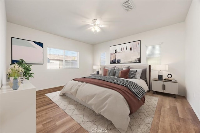 7305 Scrivia Ct, Bakersfield, CA 93311 - bedroom with light wood-style floors and ceiling fan