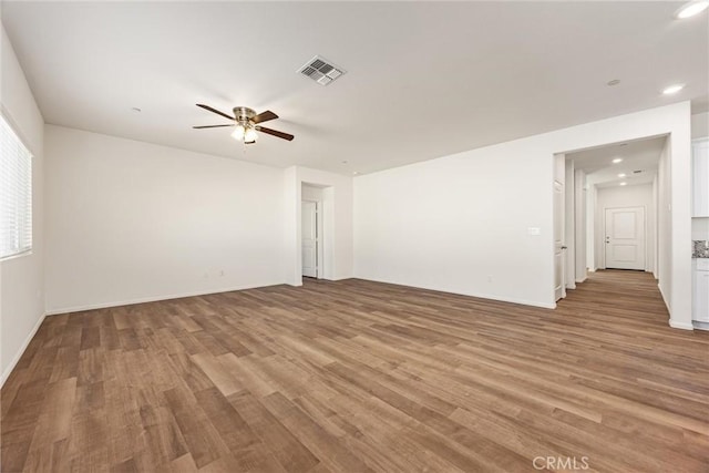 7305 Scrivia Ct, Bakersfield, CA 93311 - empty room featuring a ceiling fan, light wood finished floors, and recessed lighting