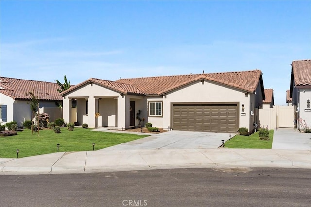 7305 Scrivia Ct, Bakersfield, CA 93311 - view of front of house featuring stucco siding, driveway, an attached garage, and a tiled roof