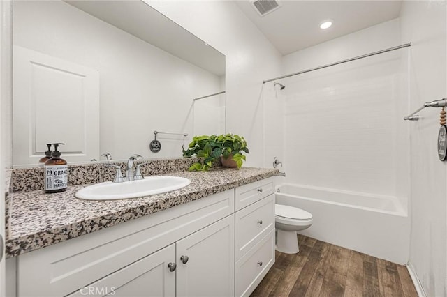7305 Scrivia Ct, Bakersfield, CA 93311 - bathroom with wood finished floors, vanity, shower / washtub combination, and recessed lighting