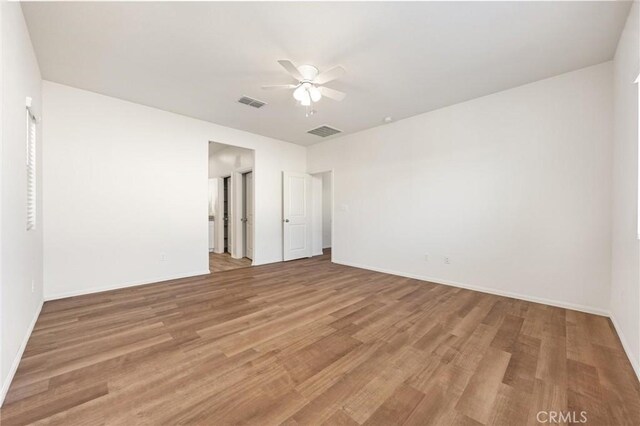 7305 Scrivia Ct, Bakersfield, CA 93311 - unfurnished bedroom with light wood-style floors and ceiling fan