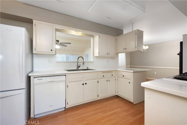 28656 Bradley Rd, Menifee, CA 92586 - kitchen featuring white appliances, light wood-style flooring, light countertops, ceiling fan, and a peninsula