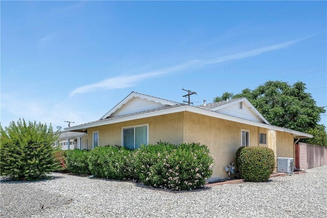 28656 Bradley Rd, Menifee, CA 92586 - view of property exterior featuring stucco siding and a cooling unit