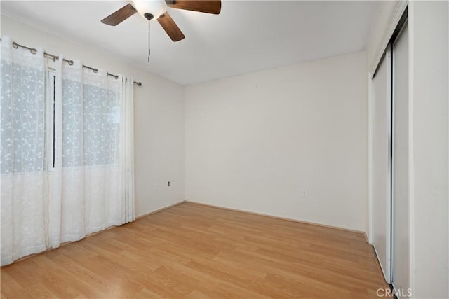 28656 Bradley Rd, Menifee, CA 92586 - unfurnished bedroom with light wood-style floors and ceiling fan