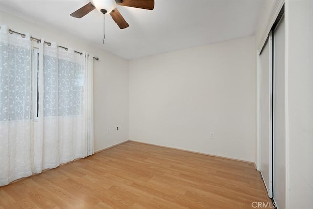 28656 Bradley Rd, Menifee, CA 92586 - unfurnished bedroom with light wood finished floors and ceiling fan