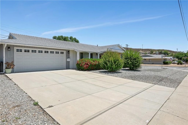 28656 Bradley Rd, Menifee, CA 92586 - ranch-style house featuring driveway, an attached garage, and roof with shingles