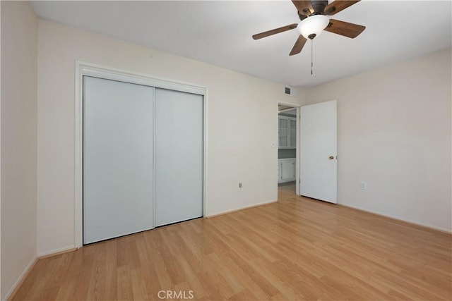 28656 Bradley Rd, Menifee, CA 92586 - unfurnished bedroom featuring light wood-type flooring, a closet, and a ceiling fan
