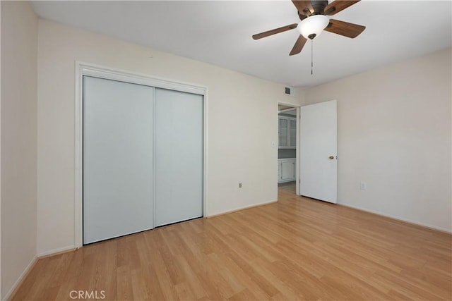 28656 Bradley Rd, Menifee, CA 92586 - unfurnished bedroom featuring light wood-type flooring, a closet, and a ceiling fan