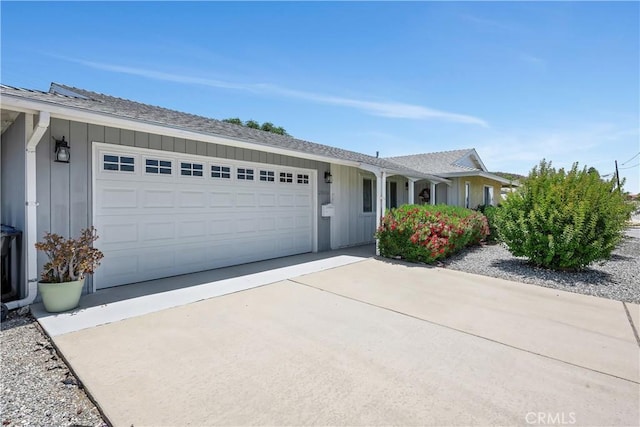 28656 Bradley Rd, Menifee, CA 92586 - single story home featuring board and batten siding, a garage, and driveway