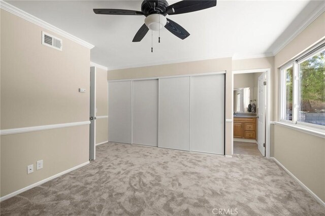 30314 Honeysuckle Hill Dr, Canyon Country, CA 91387 - unfurnished bedroom featuring carpet floors, a closet, ornamental molding, ceiling fan, and ensuite bath
