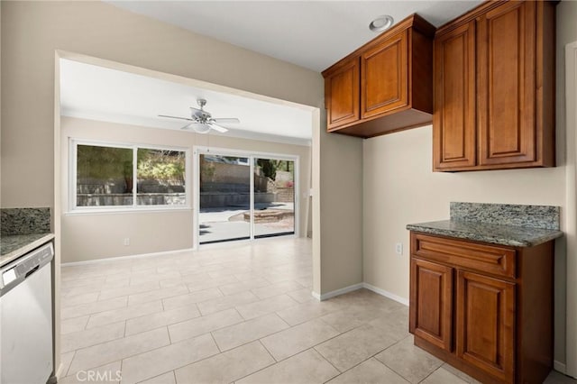 30314 Honeysuckle Hill Dr, Canyon Country, CA 91387 - kitchen featuring stainless steel dishwasher, a ceiling fan, brown cabinets, and dark stone counters