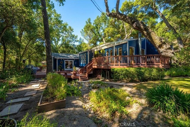 5375 Rosario Ave, Atascadero, CA 93422 - back of house with a wooden deck and a vegetable garden