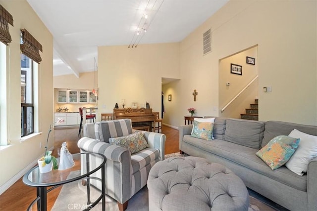 5375 Rosario Ave, Atascadero, CA 93422 - living room featuring wood finished floors, stairway, and vaulted ceiling