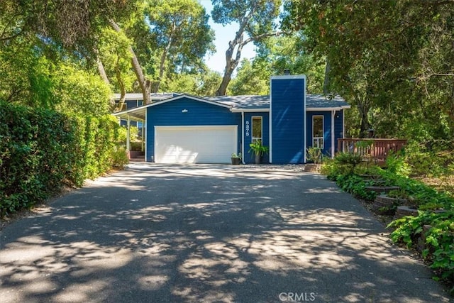5375 Rosario Ave, Atascadero, CA 93422 - view of front of home featuring asphalt driveway, a chimney, and a garage