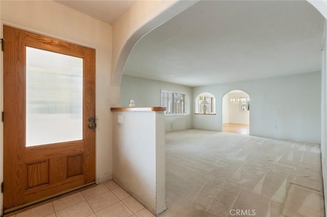 1716 Elm Ave, Manhattan Beach, CA 90266 - entrance foyer with arched walkways and light colored carpet