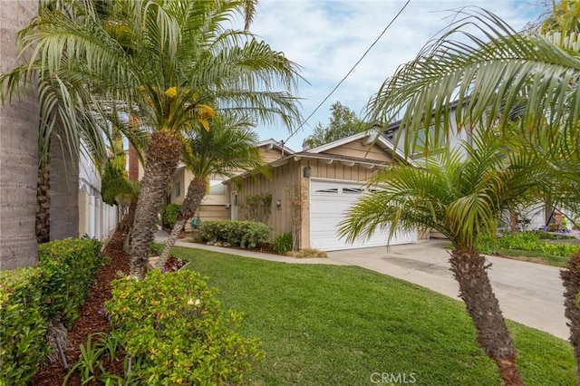 1716 Elm Ave, Manhattan Beach, CA 90266 - view of front of property featuring concrete driveway, a garage, and a front lawn