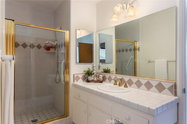 1716 Elm Ave, Manhattan Beach, CA 90266 - bathroom featuring a shower stall, vanity, and decorative backsplash