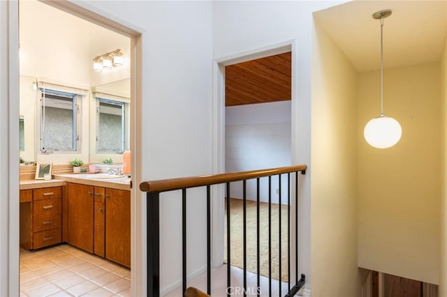 1716 Elm Ave, Manhattan Beach, CA 90266 - corridor with an upstairs landing and light tile patterned floors