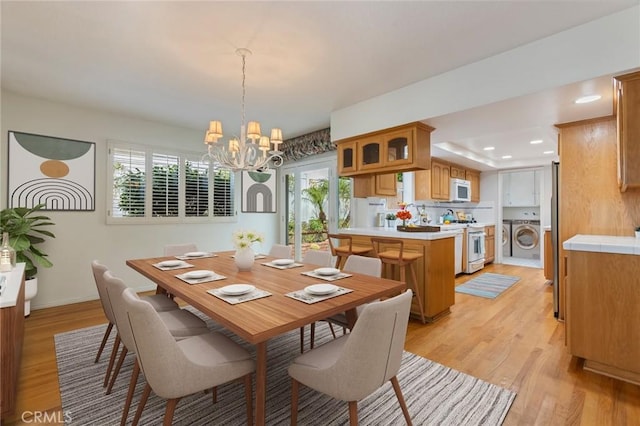1716 Elm Ave, Manhattan Beach, CA 90266 - dining space with a chandelier, washing machine and clothes dryer, light wood-style flooring, and recessed lighting