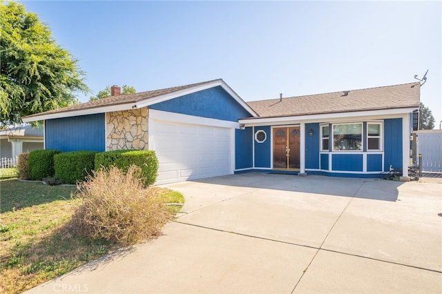 1722 Tiffany Ct, Ontario, CA 91762 - ranch-style house with concrete driveway, an attached garage, and a chimney