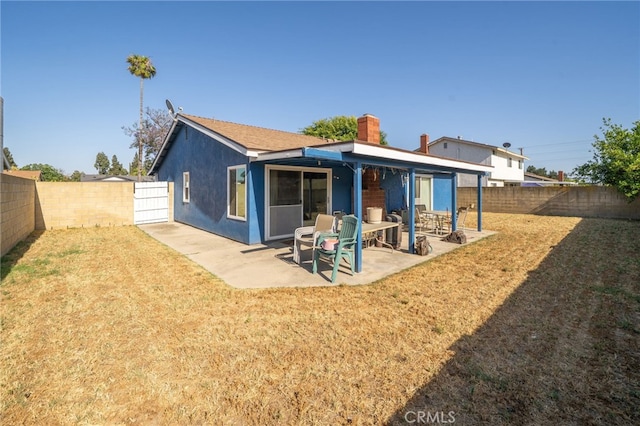1722 Tiffany Ct, Ontario, CA 91762 - rear view of house featuring a fenced backyard, a chimney, a patio area, and stucco siding