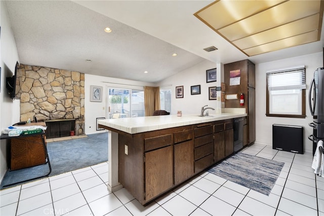 1722 Tiffany Ct, Ontario, CA 91762 - kitchen featuring tile counters, black dishwasher, a peninsula, light tile patterned floors, and open floor plan
