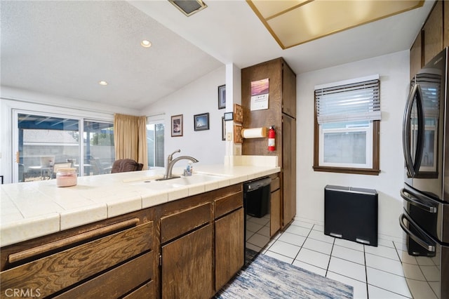 1722 Tiffany Ct, Ontario, CA 91762 - kitchen featuring smart refrigerator, black dishwasher, light tile patterned flooring, vaulted ceiling, and a peninsula