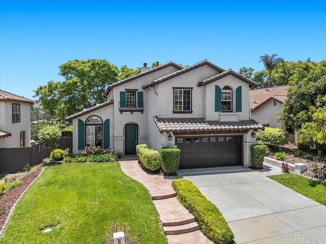 2381 Avenida Helecho, Carlsbad, CA 92009 - mediterranean / spanish-style house with concrete driveway, a garage, stucco siding, and a tile roof