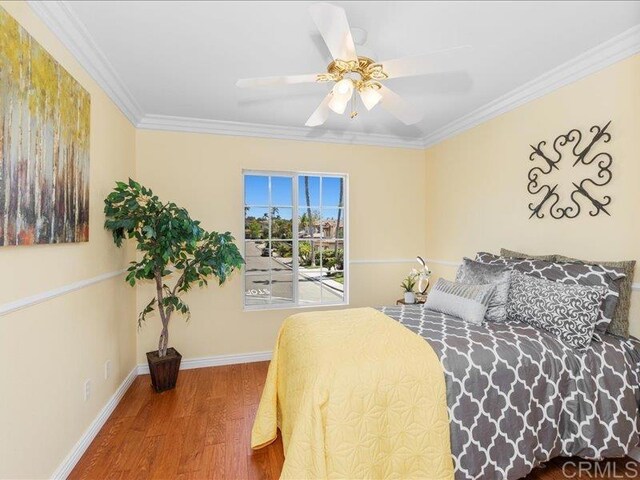 2381 Avenida Helecho, Carlsbad, CA 92009 - bedroom with wood finished floors, ornamental molding, and a ceiling fan