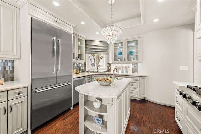 648 Harbor Island Dr, Newport Beach, CA 92660 - kitchen featuring stainless steel appliances, a chandelier, tasteful backsplash, light countertops, and white cabinets