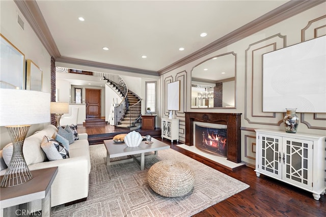 648 Harbor Island Dr, Newport Beach, CA 92660 - living room featuring crown molding, a high end fireplace, stairway, wood finished floors, and a decorative wall