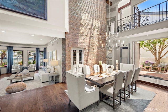 648 Harbor Island Dr, Newport Beach, CA 92660 - dining room with a high ceiling, wood finished floors, and a chandelier