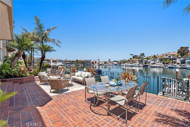 648 Harbor Island Dr, Newport Beach, CA 92660 - view of patio / terrace with an outdoor living space and a water view