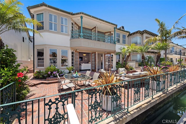 648 Harbor Island Dr, Newport Beach, CA 92660 - rear view of property featuring a balcony, a patio area, and stucco siding