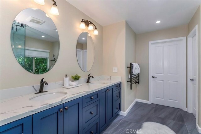 17138 Hickory Ridge Ct, Canyon Country, CA 91387 - bathroom with double vanity and baseboards