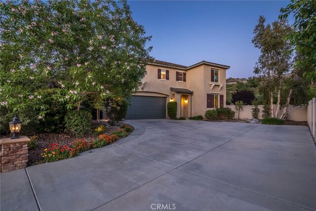 17138 Hickory Ridge Ct, Canyon Country, CA 91387 - view of front of home featuring concrete driveway, stucco siding, and an attached garage