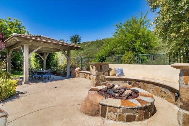 17138 Hickory Ridge Ct, Canyon Country, CA 91387 - view of patio featuring a gazebo, an outdoor fire pit, and outdoor dining area